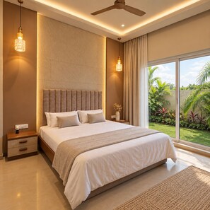 A modern bedroom with a large bed, a ceiling fan, and a view of a garden.