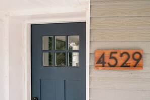 A blue door with a window and a wooden sign displaying the number 4529. - Home Away from Home w/Sauna 4BD|2BA | Berkley (Denver)