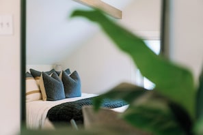 A bedroom with a bed, pillows, and a window. - Home Away from Home w/Sauna 4BD|2BA | Berkley (Denver)