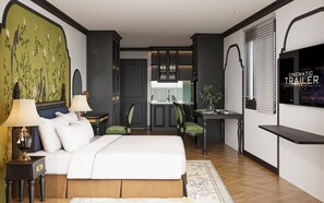 Una habitación de hotel moderna con una cama grande, un escritorio y una televisión.