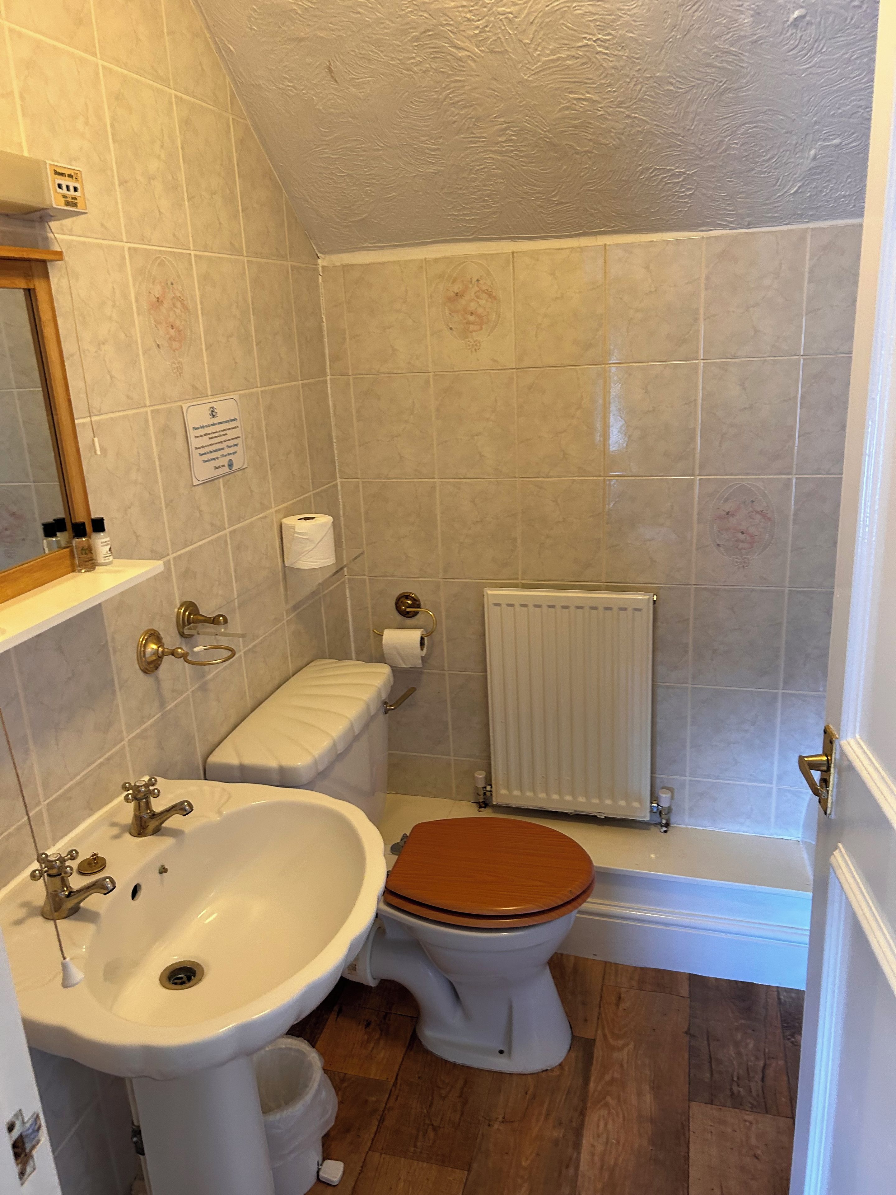 A bathroom with a sink, toilet, and bathtub.