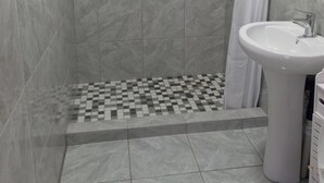 A bathroom with a shower, a sink, and a toilet. - Room-tranquil Forest Studio Retreat in W (Westville)