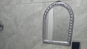 A bathroom with a white pedestal sink, a mirror with an ornate frame, and a toilet paper holder. - Room-tranquil Forest Studio Retreat in W (Westville)