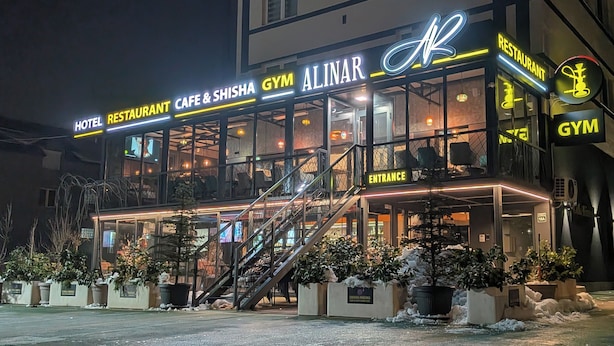 A multi-story building with a gym, cafe, and restaurant on the ground floor. - Alinar Oasis Budget Hotel (Sarajevo)
