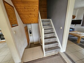 A staircase with wooden steps leading to a lower level. - Holiday Home Kretscham with Private Terrace and Garden (Sehmatal)