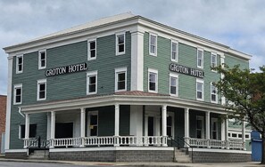 A two-story building with the sign 'GROTON HOTEL' on the facade. - Spacious 2 bedroom apartment located minutes from Ithaca, Cornell, Cortland (Groton)