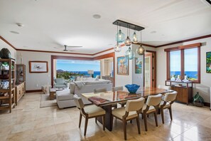 A spacious living area with a dining table, seating, and a view of the ocean. - Wailea Beach | 2 Oceanfront Villas, Sleeps 14 | Car Incl. w/ 6+ Nights | ML-4274 by KBM (Wailea)