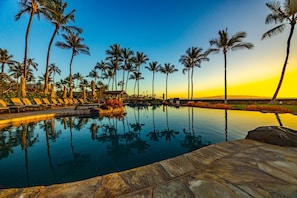 A pool with lounge chairs and palm trees. - Wailea Beach | 2 Oceanfront Villas, Sleeps 14 | Car Incl. w/ 6+ Nights | ML-4274 by KBM (Wailea)