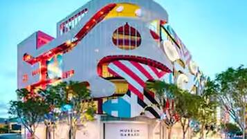 A building with a unique architectural design, featuring a large, colorful spiral structure on its facade.