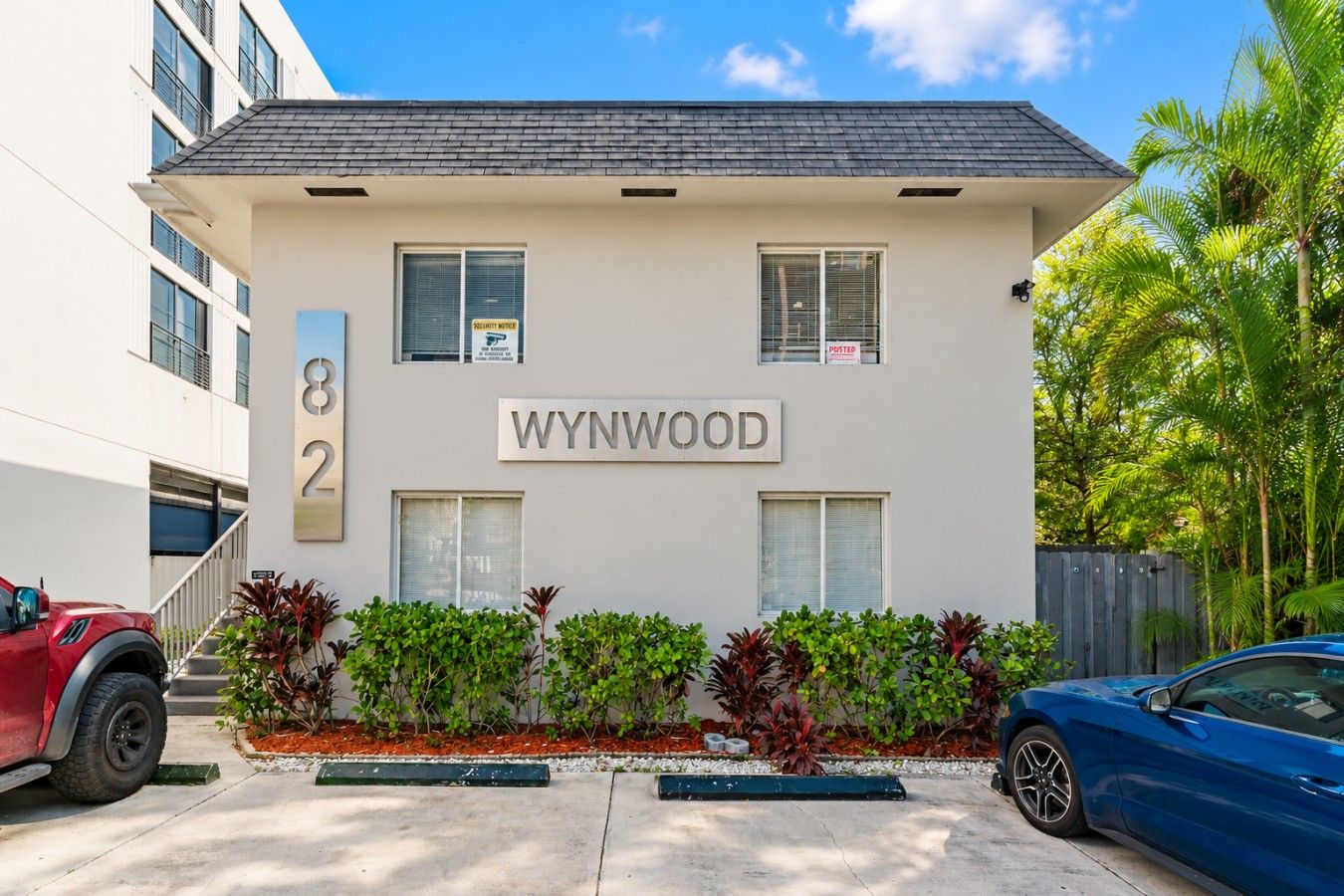 A building with the name 'WYNWOOD' and the number '82' on its facade.