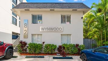 A building with the name 'WYNWOOD' and the number '82' on its facade.