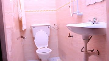 Standard Double Room | Bathroom | Shower, slippers, towels, soap
