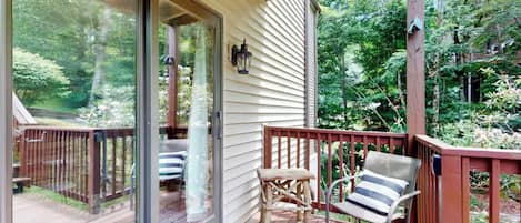 Step out onto your private balcony and sink into a cozy chair surrounded by lush forest greenery—your perfect spot for morning coffee or watching the trees sway in the breeze.