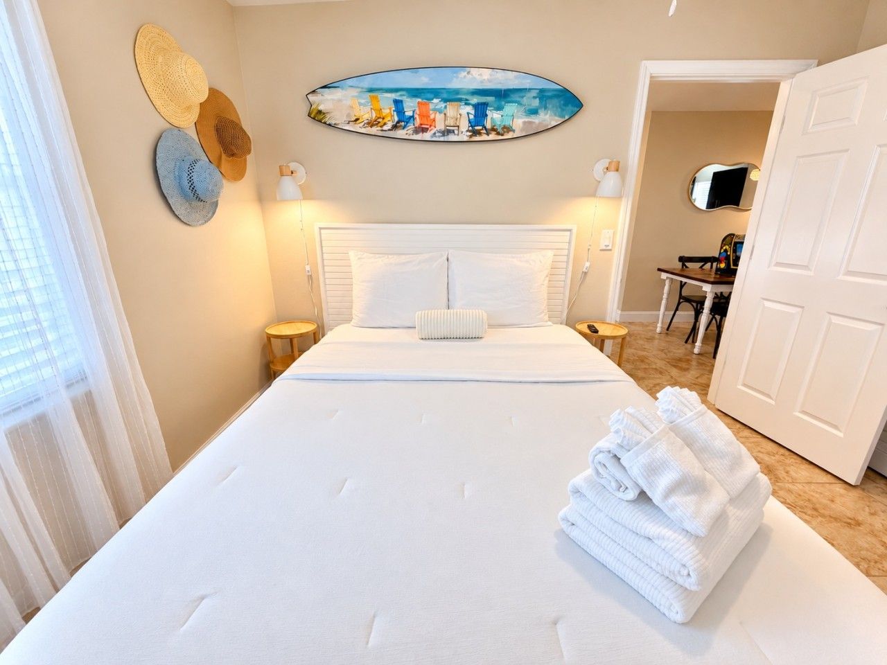 Bright, breezy bedroom with a comfy queen bed and playful coastal touches.