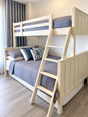 A bunk bed with a ladder, pillows, and a blanket. - The Penthouse at Vista Alta (Punta Cana)