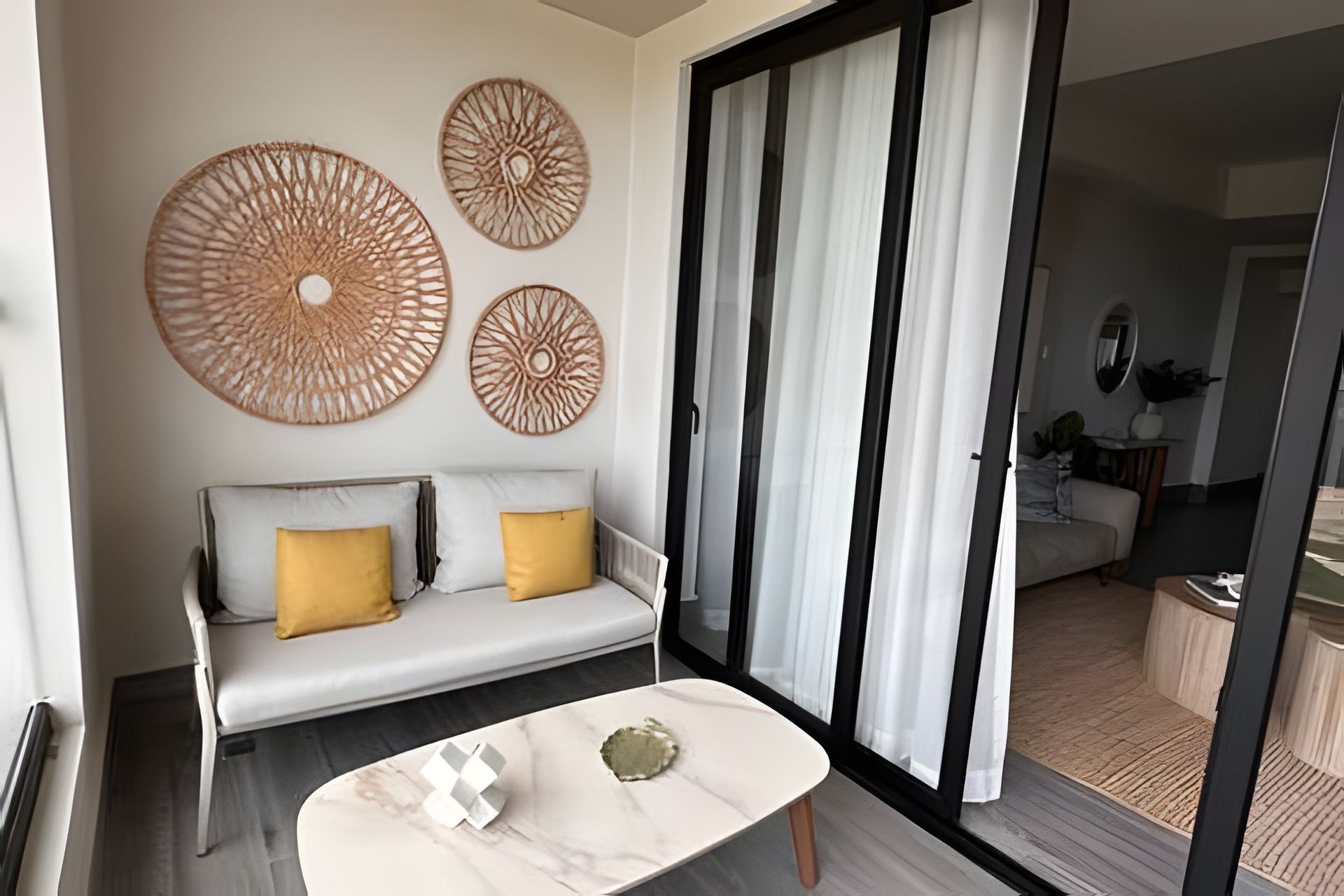 A modern living room with a sofa, a coffee table, and decorative wall art.
