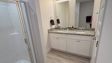 Shower, towels, soap, toilet paper
