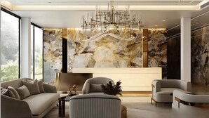 A modern living room with a sofa, armchairs, a coffee table, and a unique chandelier. - Aura Hotel & Suites  (Mississauga)