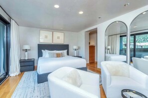 A modern hotel room with two beds, a large mirror, and a view of the outdoors. - Ski-In/Ski-Out 4BR Penthouse w/ Views, Pools & Spa (Mountain Village)
