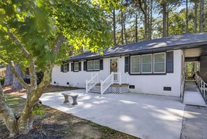 A single-story house with a front porch, a staircase, and a small garden area. -  3-bedrooms in Rocky Mount: 5-15 min. of Event & imperial Ctrs & Sports Complex, (Rocky Mount)