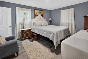 A bedroom with a bed, nightstands, a dresser, a chair, and a window with curtains. -  3-bedrooms in Rocky Mount: 5-15 min. of Event & imperial Ctrs & Sports Complex, (Rocky Mount)