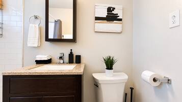 Shower, hair dryer, towels, shampoo