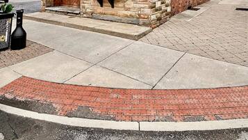 A brick building with a sign for 'Tiki Underground' and a window display.