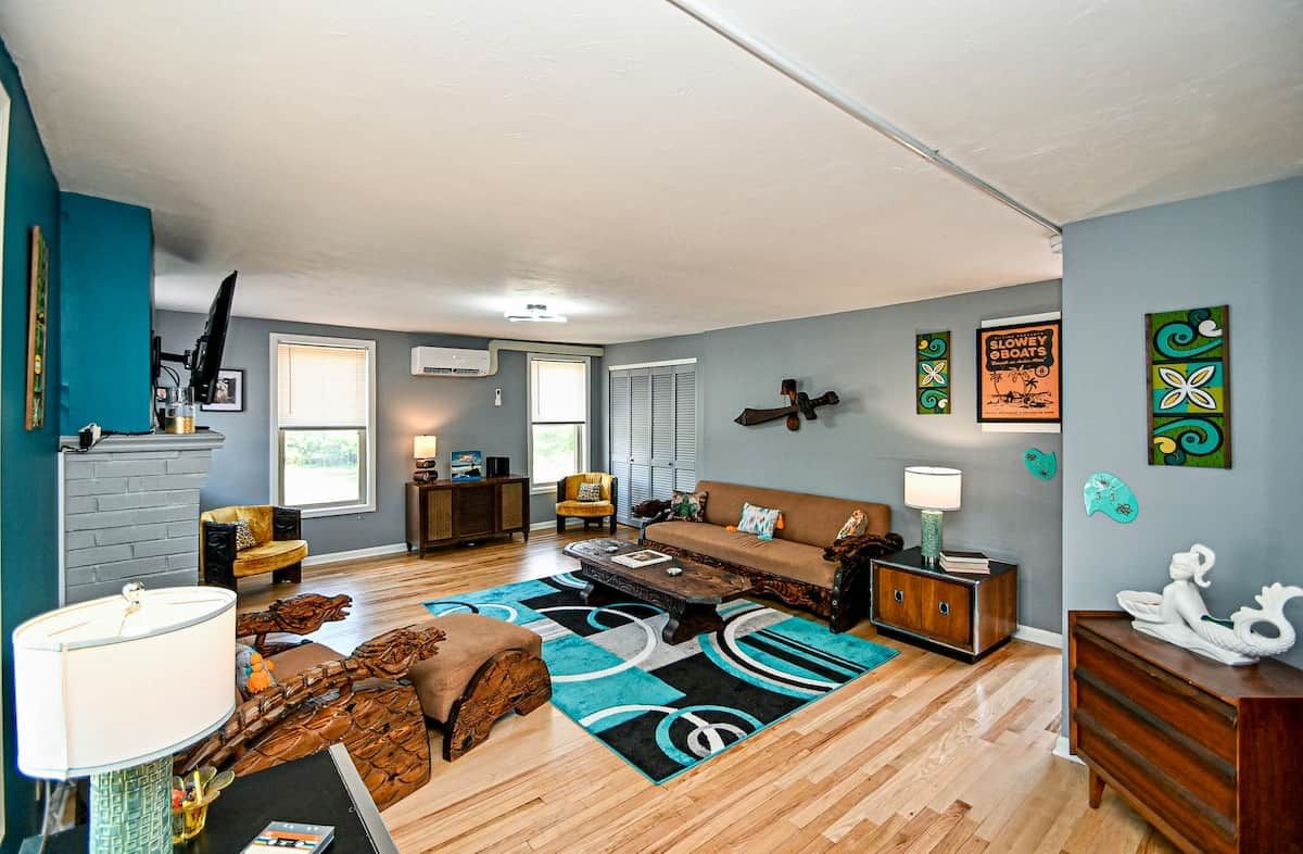 A living room with a sofa, coffee table, and decorative items.