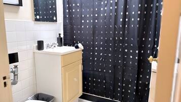 Shower, hair dryer, towels, shampoo
