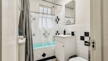 Shower, hair dryer, towels, shampoo