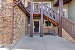 A stone exterior wall, a wooden staircase, and a door with the number 16. - Jennings Lake House LS76 | 3 Bed | Hot Tub | Pool (Huntsville)