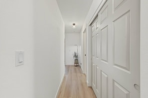Bright modern hallway with light wood floors and ample closet storage - Scottsdale Retreat Private Hot Tub (Scottsdale)
