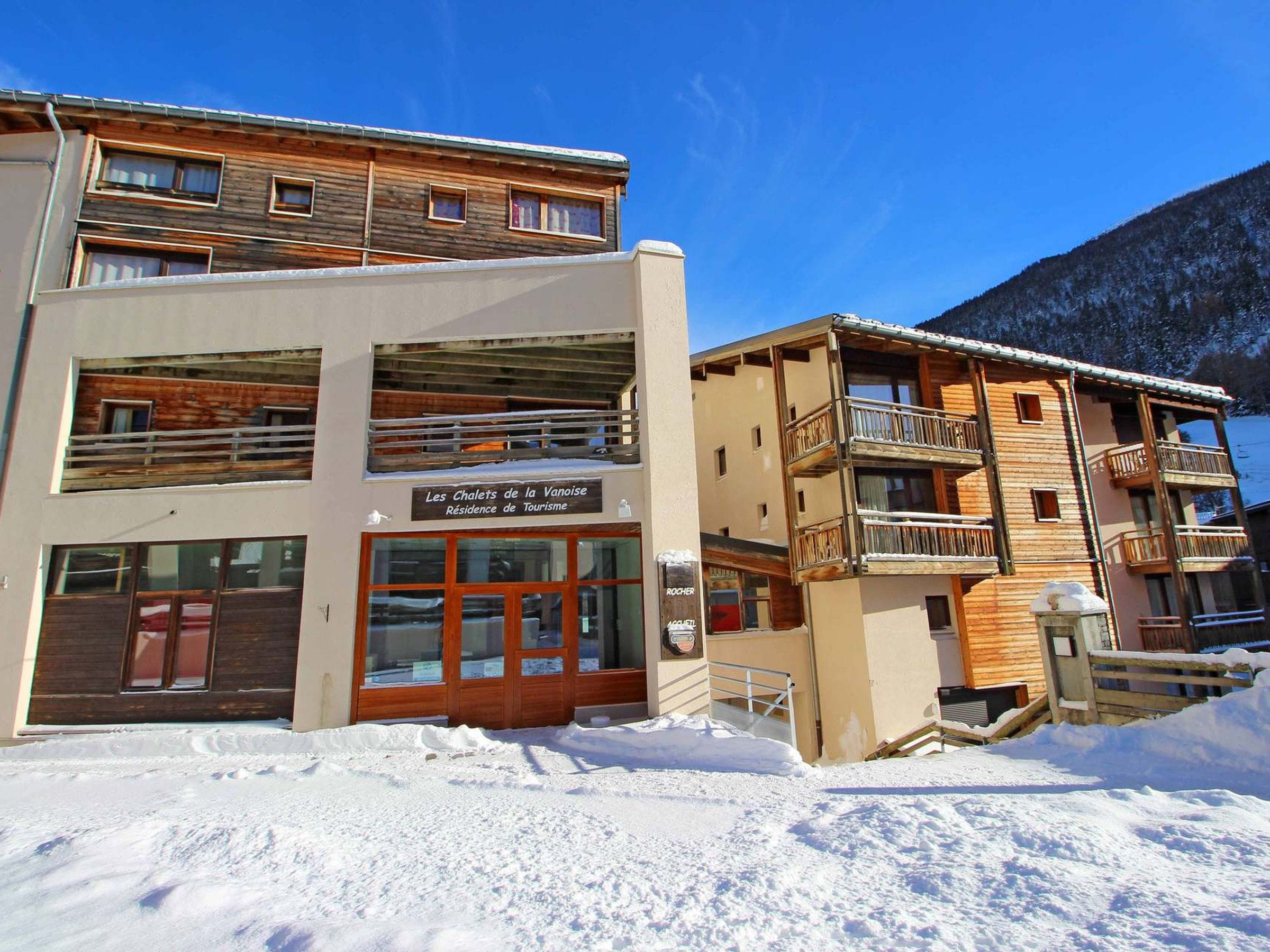 A two-story building with a sign indicating it's a tourism residence.
