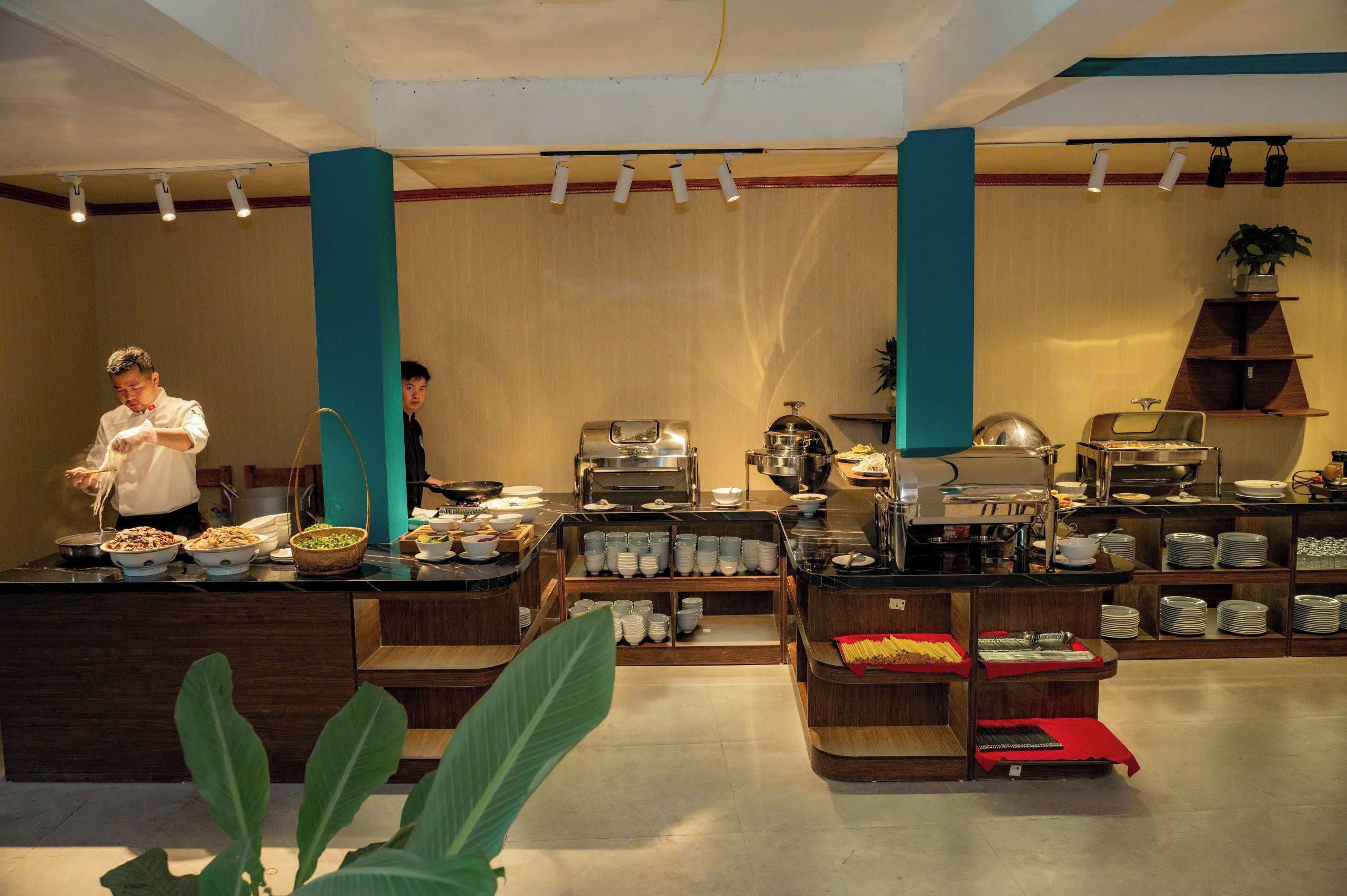 A buffet area with various food stations, a buffet counter, and a coffee station.