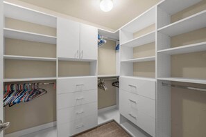 A walk-in closet with open shelving, hanging space, and drawers. - Fully Furnished 5BR 3 Baths Family Home in Everett (Snohomish County)