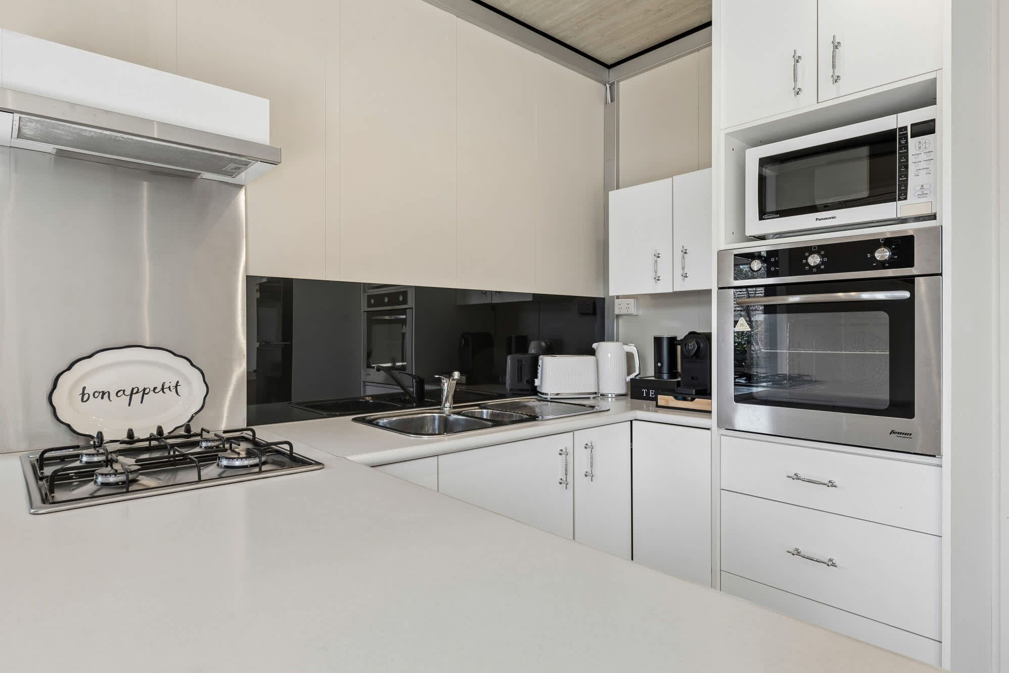 Coffee/tea maker, fridge, microwave, oven