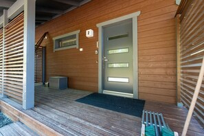 A wooden building with a grey door, a number '2' sign, and a small window. - Diverse outdoor activities, incl. end cleaning (Rukatunturi)