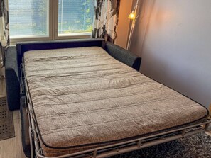 A bed with a metal frame, a mattress, and a headboard. - Amazing for outdoors. Incl. cleaning and wifi (Rukatunturi)