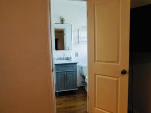 A bathroom with a sink, mirror, and toilet. - Upgraded Quiet 1 bed, 1 bath Share home, mins to UofA, Downtown & Shopping (Tucson)