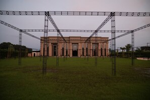 A building with a symmetrical facade, large windows, and a central entrance.