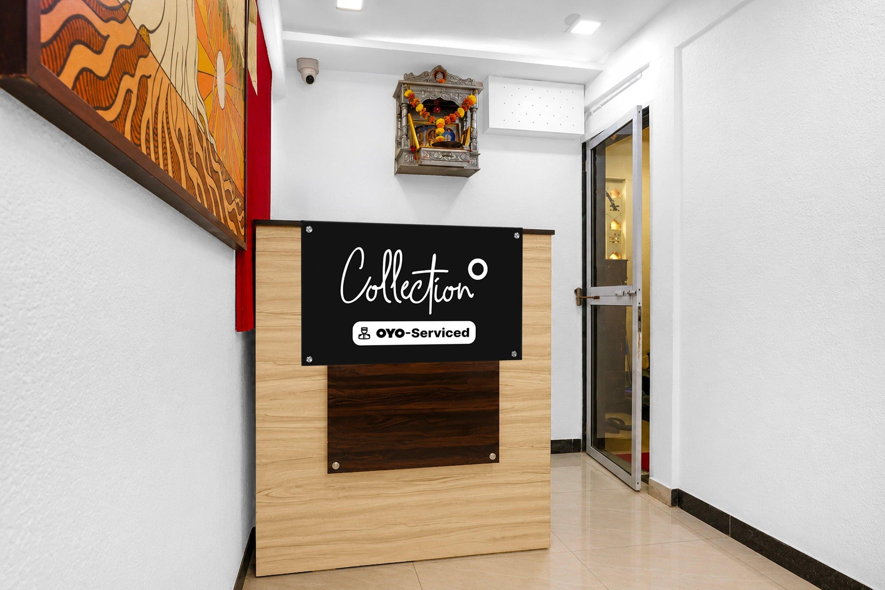 A reception desk with a sign that reads 'Collection' and 'YO-Serviced'.