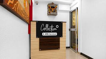 A reception desk with a sign that reads 'Collection' and 'YO-Serviced'.