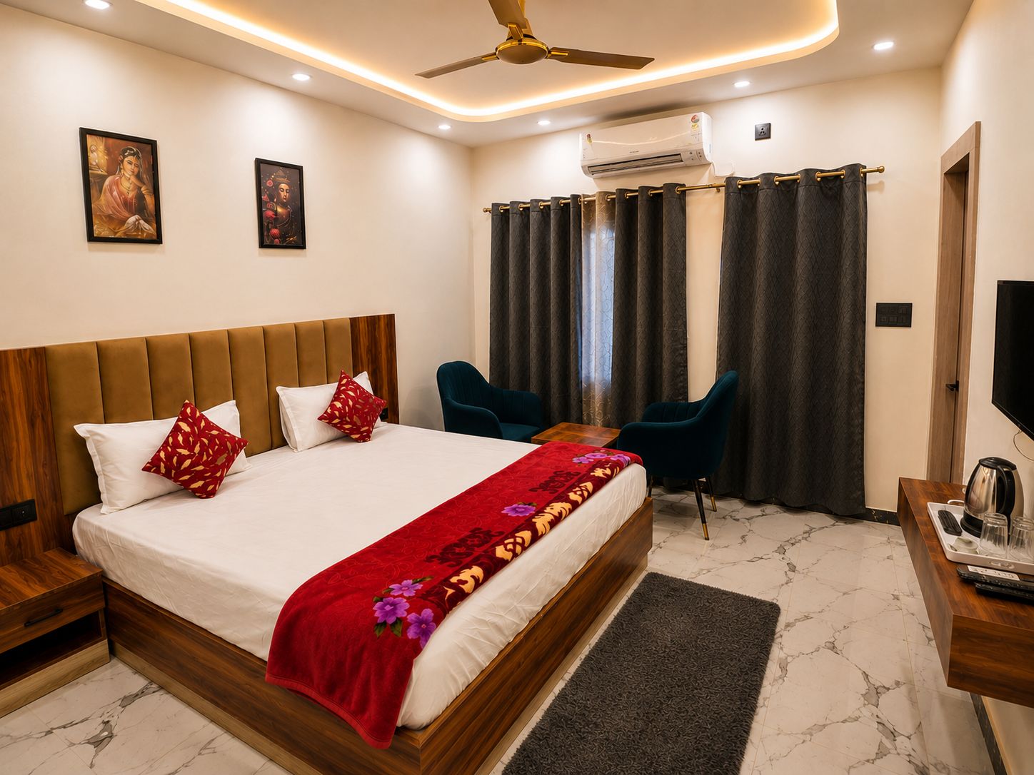 A hotel room with a bed, a desk with a coffee maker, a TV, and a ceiling fan.