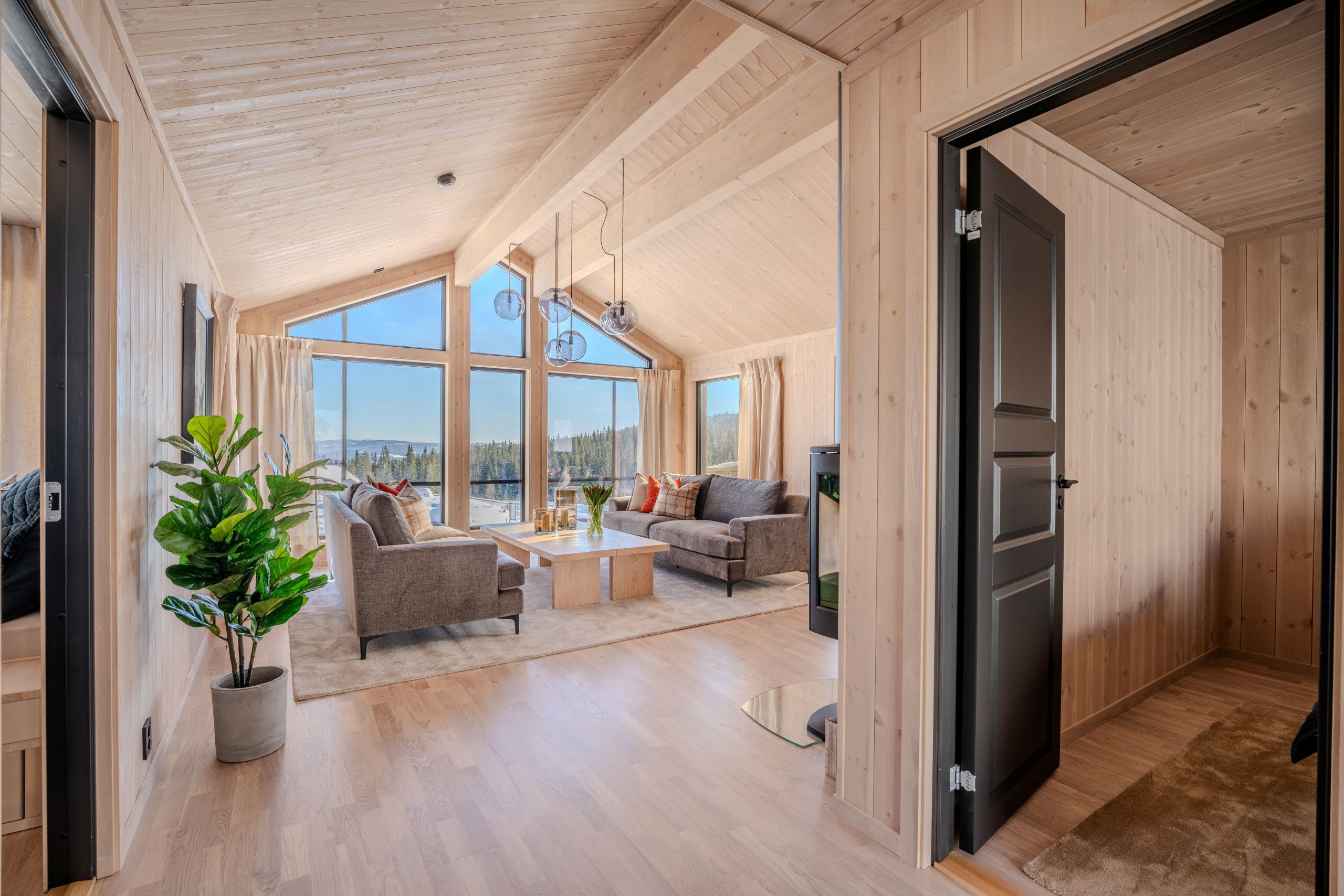 A spacious loft with high ceilings, large windows, and a modern interior.