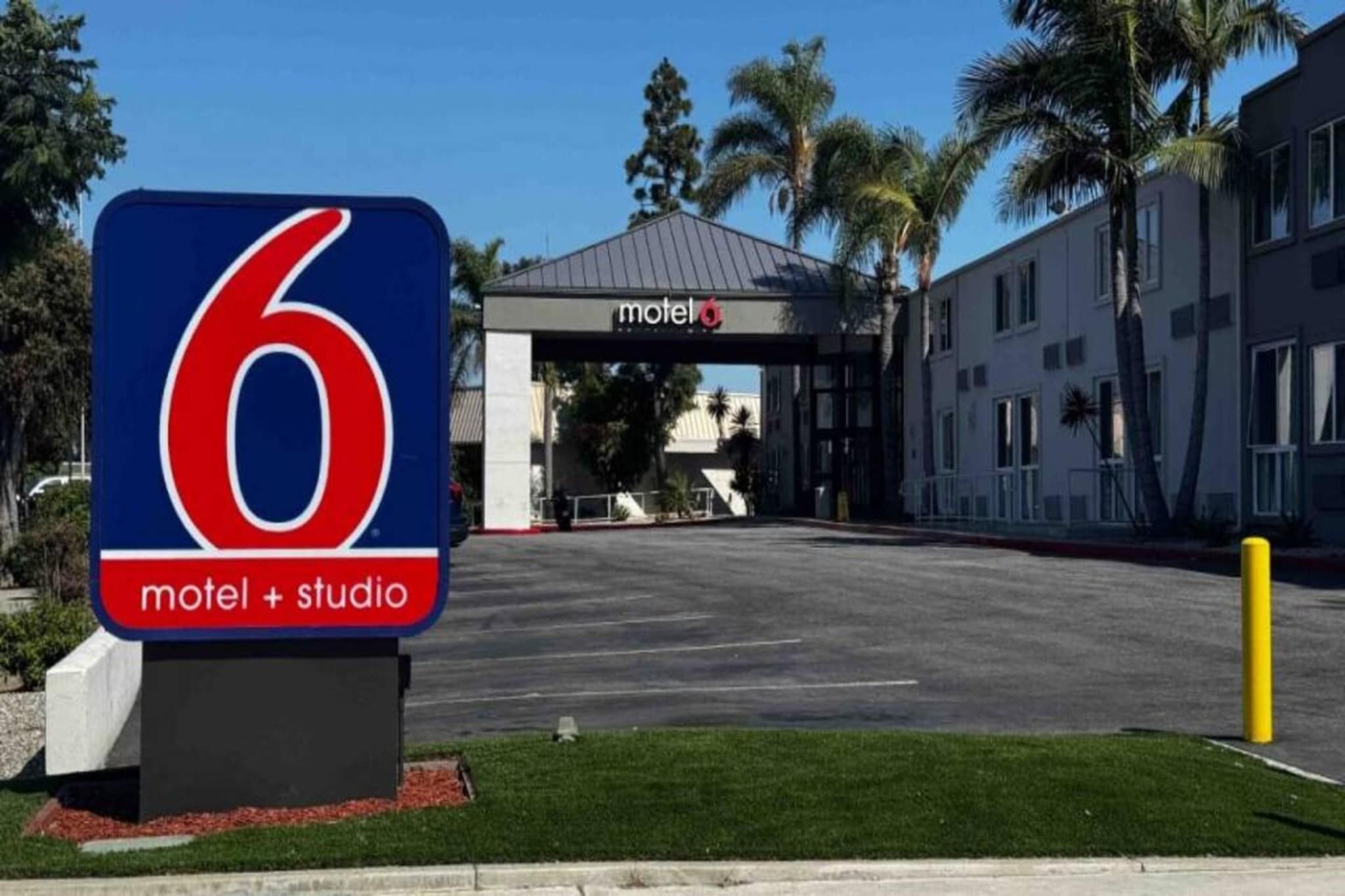 A motel sign with a number 6 and the words 'motel + studio' indicating the establishment.