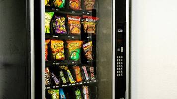 A vending machine stocked with various snack brands.