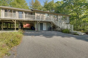 A two-story house with a covered porch and a staircase leading to the upper level. - Gateway to Acadia Nat'l Park! Peaceful Home (Ellsworth)