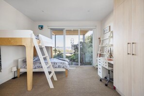 A modern bedroom with a bunk bed, a desk, and a wardrobe. - Stanley House Mt Martha. (Mount Martha)