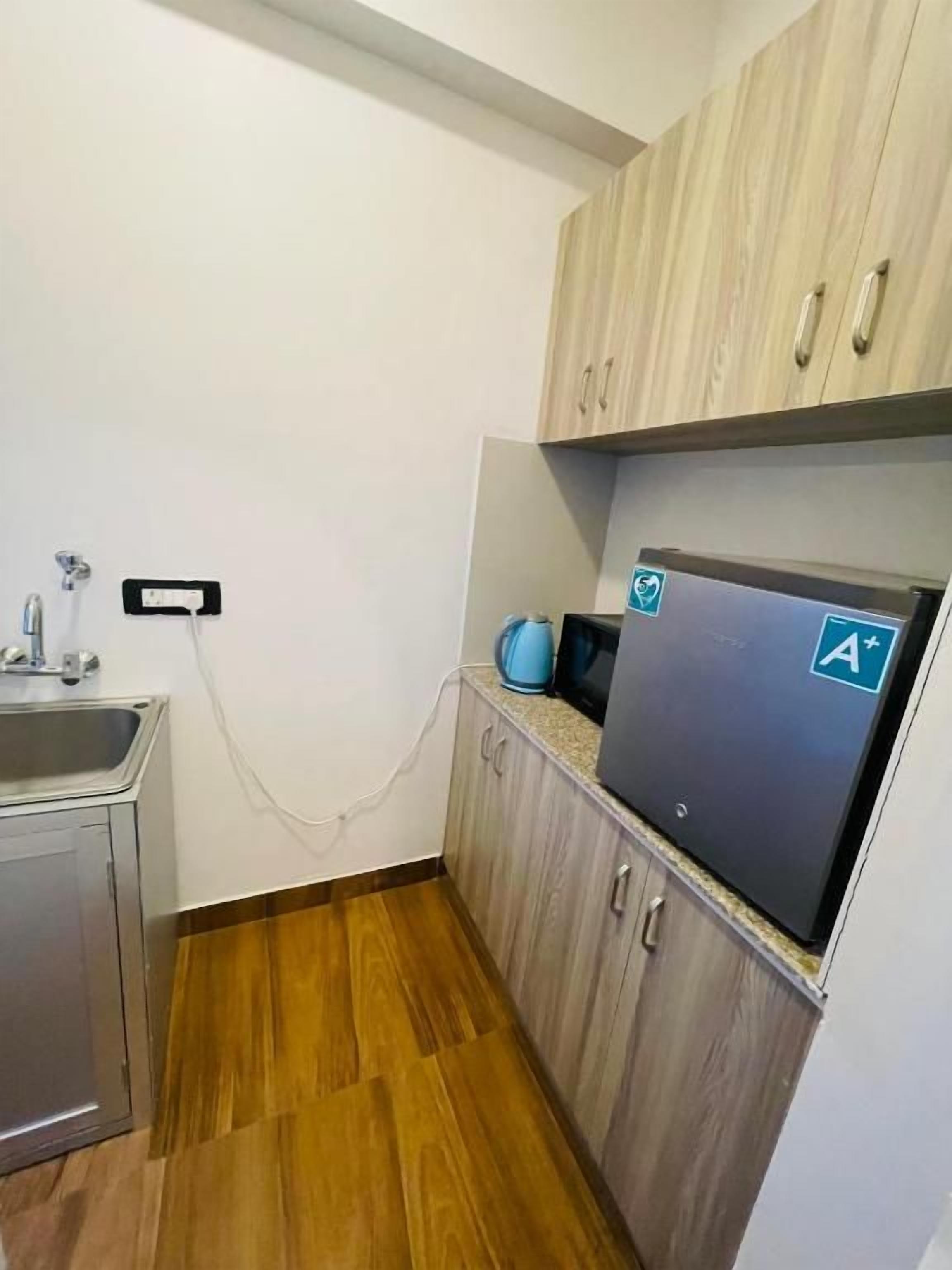 Comfort Triple Room, City View | Private kitchen