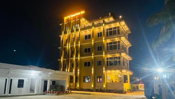 A multi-story hotel with a well-lit facade, a visible entrance, and a parking area. - Hotel Janakpur Inn (Janakpur)